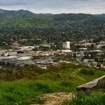 a view of a city from a hill