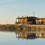 a building next to a body of water