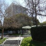 a building with trees and grass