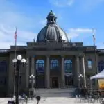 a building with a dome and flags