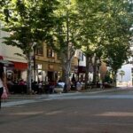 a woman walking down a street