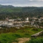 a view of a city from a hill