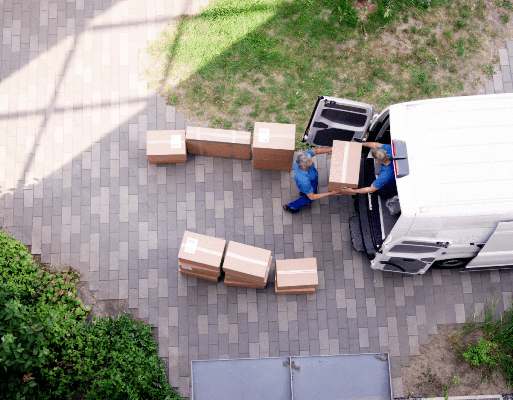 men loading boxes into a van